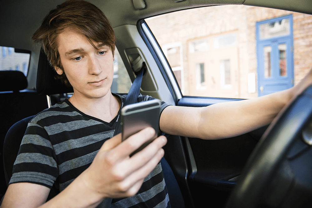 Distracted teenage driver on the phone
